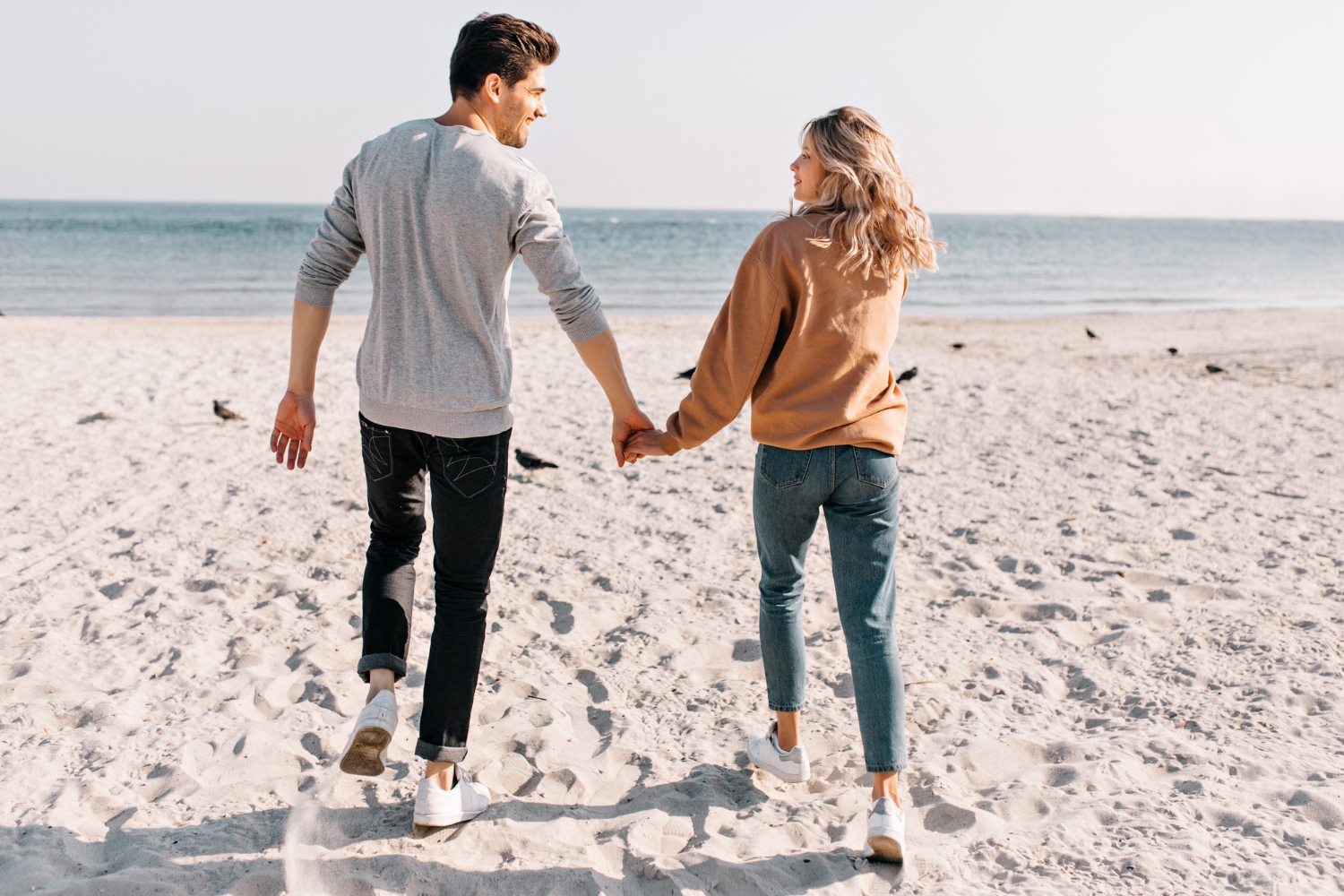 positive-couple-running-sea-with-smile-outdoor-portrait-pretty-girl-holding-hands-with-boyfriend-during-rest-beach